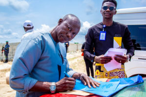 Client signing a land purchase agreement during an allocation